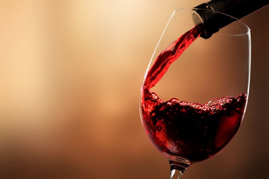 red-wine-pouring-from-bottle-glass.width-1920
