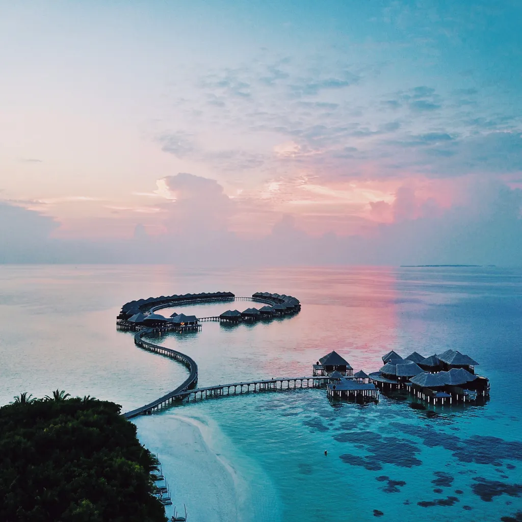 vista pájaro sobre el agua villas Maldivas